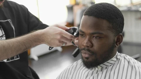 man receiving a hair cut